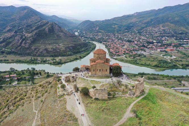 The Svetitskhoveli Cathedral, standing at the confluence of two rivers, is truly remarkable. Photo by Patrick Keller on unsplash.com