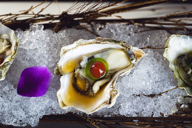 Make sure to grab a glass of champagne to accompany your West Coast oysters, which you can get at great prices here. Photo by Edrece Stansberry on unsplash.com