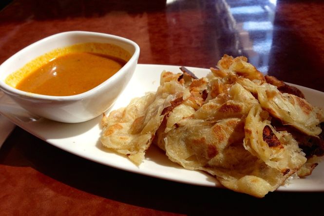 Roti Canai. Photo by ZhengZhou. Cropped from original. License: CC BY-SA 4.0