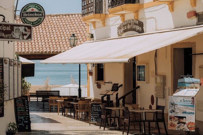 A restaurant at a promenade in Lisbon. Photo by Humphrey Muleba on Unsplash