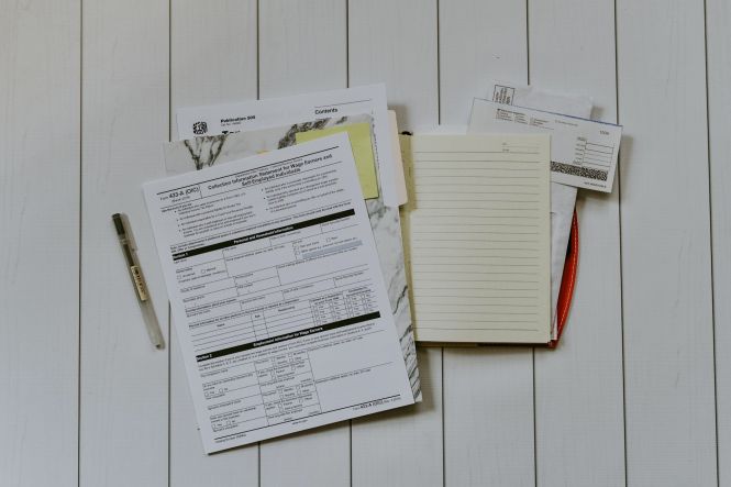 Stack of papers. Photo by Kelly Sikkema on Unsplash