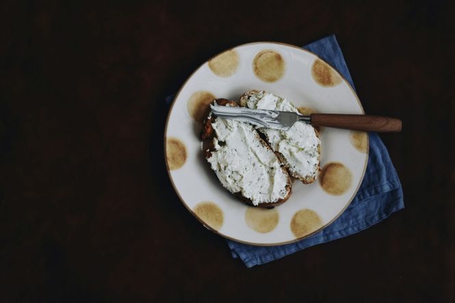A sandwich with creamy cheese. Photo by Gaelle Marcel on Unsplash