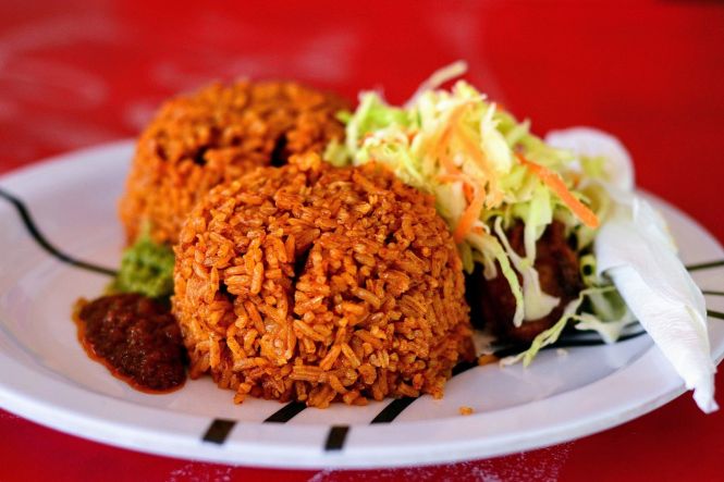 Jollof rice with stew. Photo by Noahalorwu, cropped from original. License: CC BY-SA 4.0