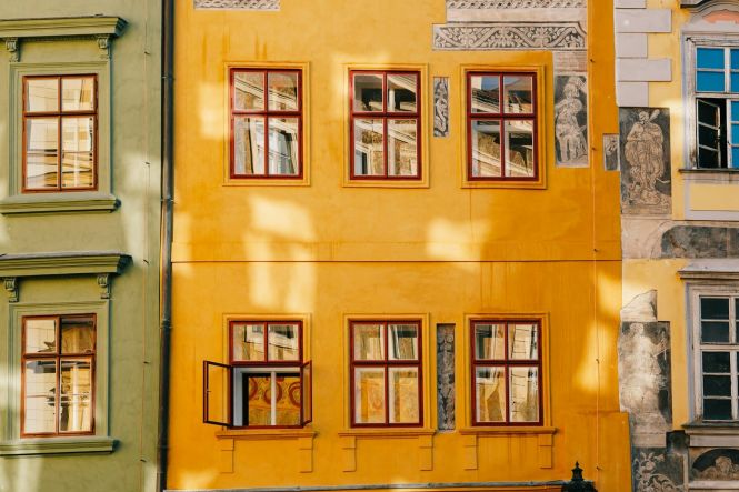A yellow building in Prague. Photo by Shushan Meloyan on Unsplash