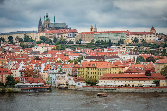 A view of Prague from across a riverPhoto by Mihail Cioinica on Unsplash